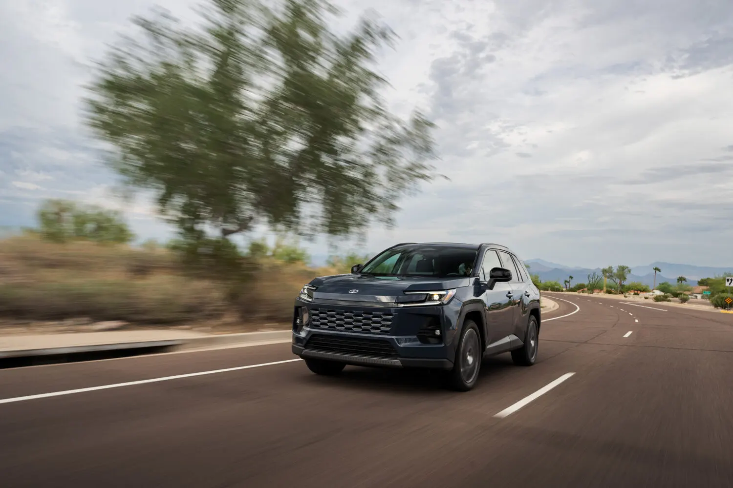 Toyota RAV4 Hybrid driving on an open road